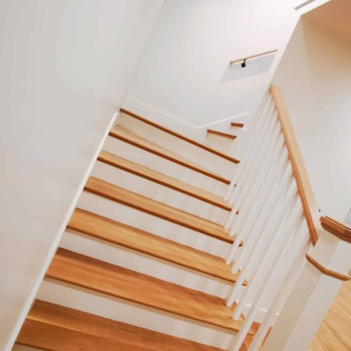modern Edge Contracting house remodel white oak stairscase and handrail